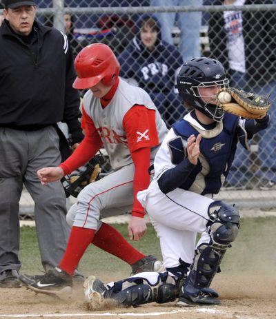 Ferris’ Taylor Jones scores on a sacrifice fly in the fourth inning as Kane Ulrich takes the throw home. (Dan Pelle)