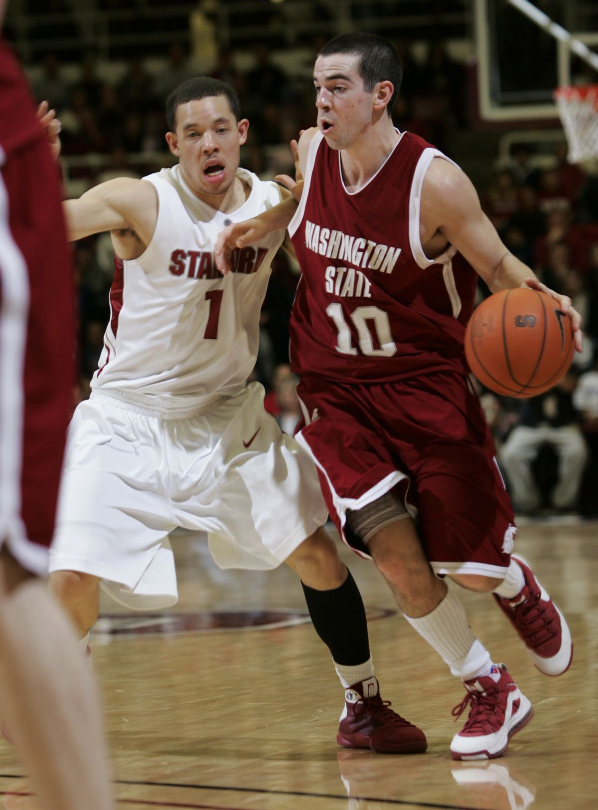 Washington State guard Taylor Rochestie is covered by Stanford guard Mitch Johnson. Stanford defeated Washington State 65-54. (Paul Sakuma / Associated Press)