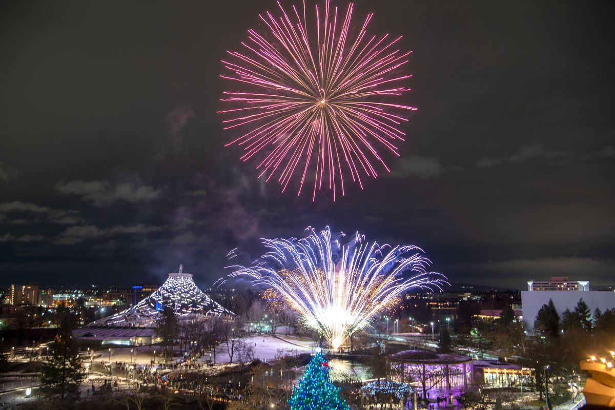 Thousands watch as fireworks explode over Riverfront Park at precisely 9 p.m. on New Year’s Eve in Spokane on Tuesday, Dec. 31, 2019.  (Jesse Tinsley/The Spokesman-Review)
