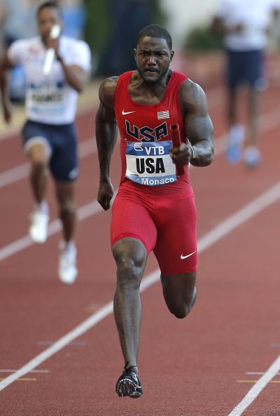 Justin Gatlin won the men’s 100 meters and led the U.S. to a triumph in the 4x100 relay. (Associated Press)