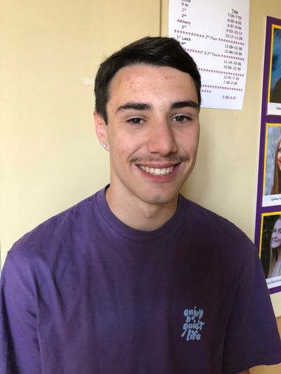 Anthony Dearfield poses for a picture after signing his letter of intent to run track at Central Washington at Rogers High School on Tuesday, July 26, 2022.  (Dave Nichols)