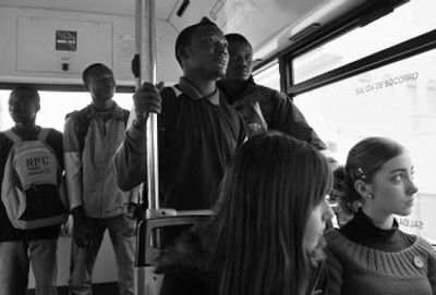 
Edwin Tholley, second from right, stands with fellow students Victor Young, right, Gabriel Kamara, second from left, and Daniel Dumbuya on their way to the university in Almeria, Spain, March 27. 
 (Associated Press / The Spokesman-Review)