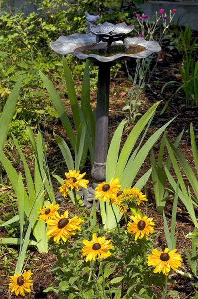 
A bird bath was just one of the many ornamental features in a Spokane garden tour last year. 
 (File/ / The Spokesman-Review)