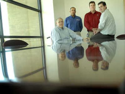 
TierPoint executives, from left, Bernard Daines, Octavio Morales, Chris Walter and Dan Seliger at their headquarters. 
 (Brian Plonka / The Spokesman-Review)