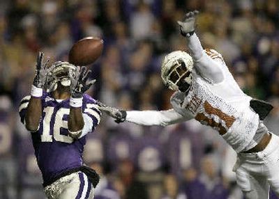 
Kansas State wide receiver Yamon Figurs, left, catches a pass through the Texas defense. 
 (Associated Press / The Spokesman-Review)