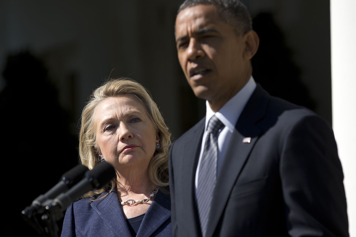 Secretary of State Hillary Rodham Clinton listens as President Barack Obama speaks on the death of U.S. ambassador to Libya Christopher Stevens, Wednesday, Sept. 12, 2012, in the Rose Garden of the White House in Washington. (Evan Vucci / Associated Press)