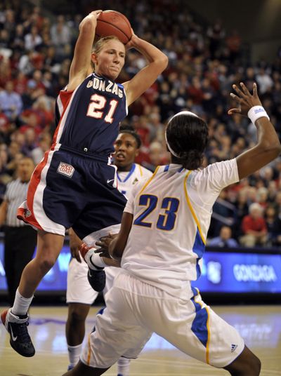 Courtney Vandersloot, who had 29 points and 17 assists, has UCLA's Markel Walker back-peddling. (Colin Mulvany)