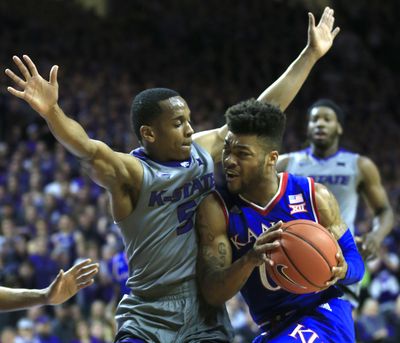 Kansas guard Frank Mason III, right, drives against Kansas State guard Barry Brown during the first half of an NCAA college basketball game in Manhattan, Kan., Monday, Feb. 6, 2017. (Orlin Wagner / Associated Press)