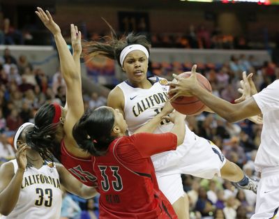 Brittany Boyd and Cal ran into the buzzsaw defense of Cortnee Walton (13), Monique Reid (33) and Louisville on Sunday. (Associated Press)