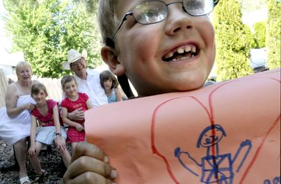 Brayden Godin, 6, displays a drawing he did on Wednesday. The drawing was part of counseling sessions that have been donated to the family after their story was featured in The Spokesman-Review. (Kathy Plonka / The Spokesman-Review)