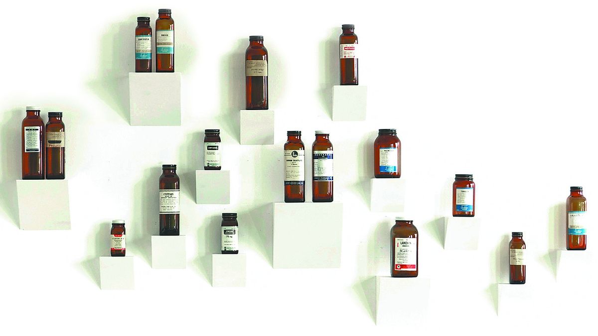 New York designer David Kassel’s company ILevel Inc. chose this vintage medicine bottle collection as the basis for a salon wall. (Associated Press)