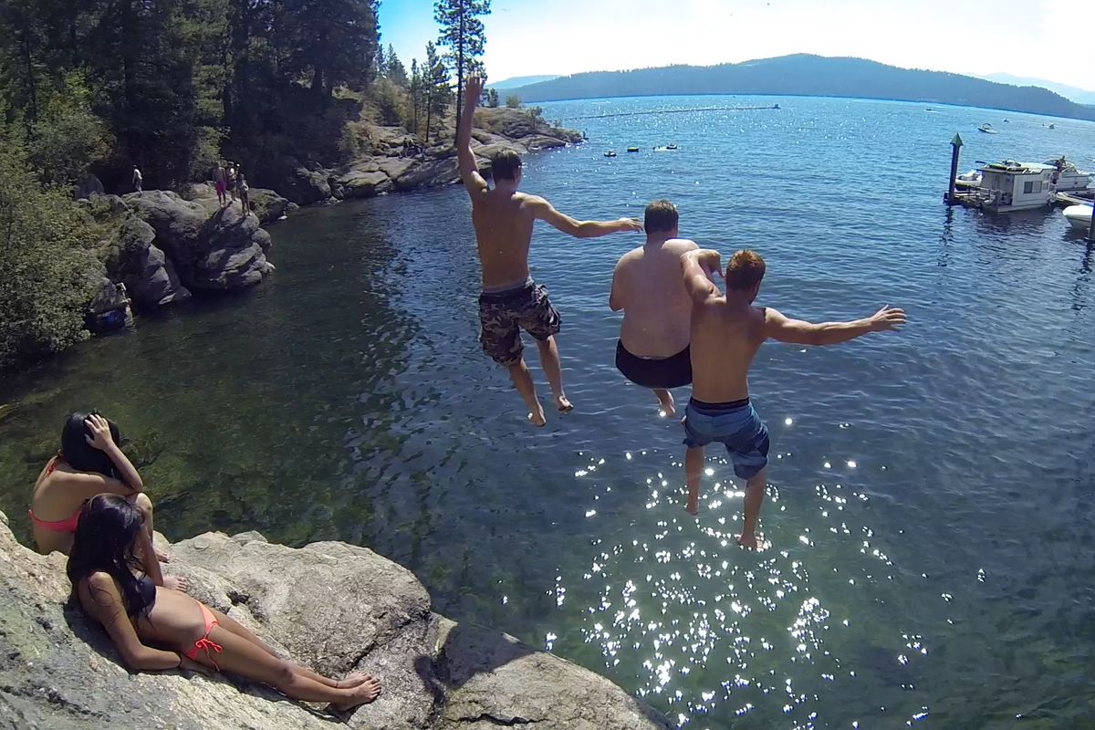 Konnor Mein, Joey Nowoj and Jason Koehn find jumping together with friends helps lessen the fear and increases the thrill of Tubbs Hill cliff diving. (Jesse Tinsley)