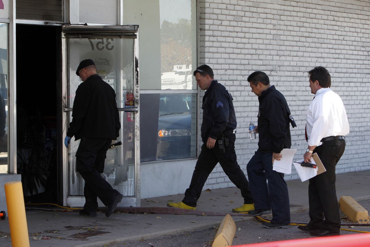 Police investigators walk into Fero