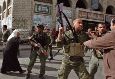 
Palestinian Fatah-loyalist security forces confront Hamas supporters as they try to prevent them from holding a rally in the West Bank town of Ramallah on Friday. 
 (Associated Press / The Spokesman-Review)