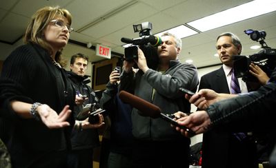 Alaska Gov. Sarah Palin talks to media after she arrived at her office in Anchorage, Alaska, on Friday.  (Associated Press / The Spokesman-Review)