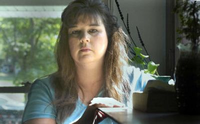 
Pam Brault, administrator of Memory Lane Oak Hill Inc., visits a damaged group home on the South Hill.  
 (Christopher Anderson / The Spokesman-Review)