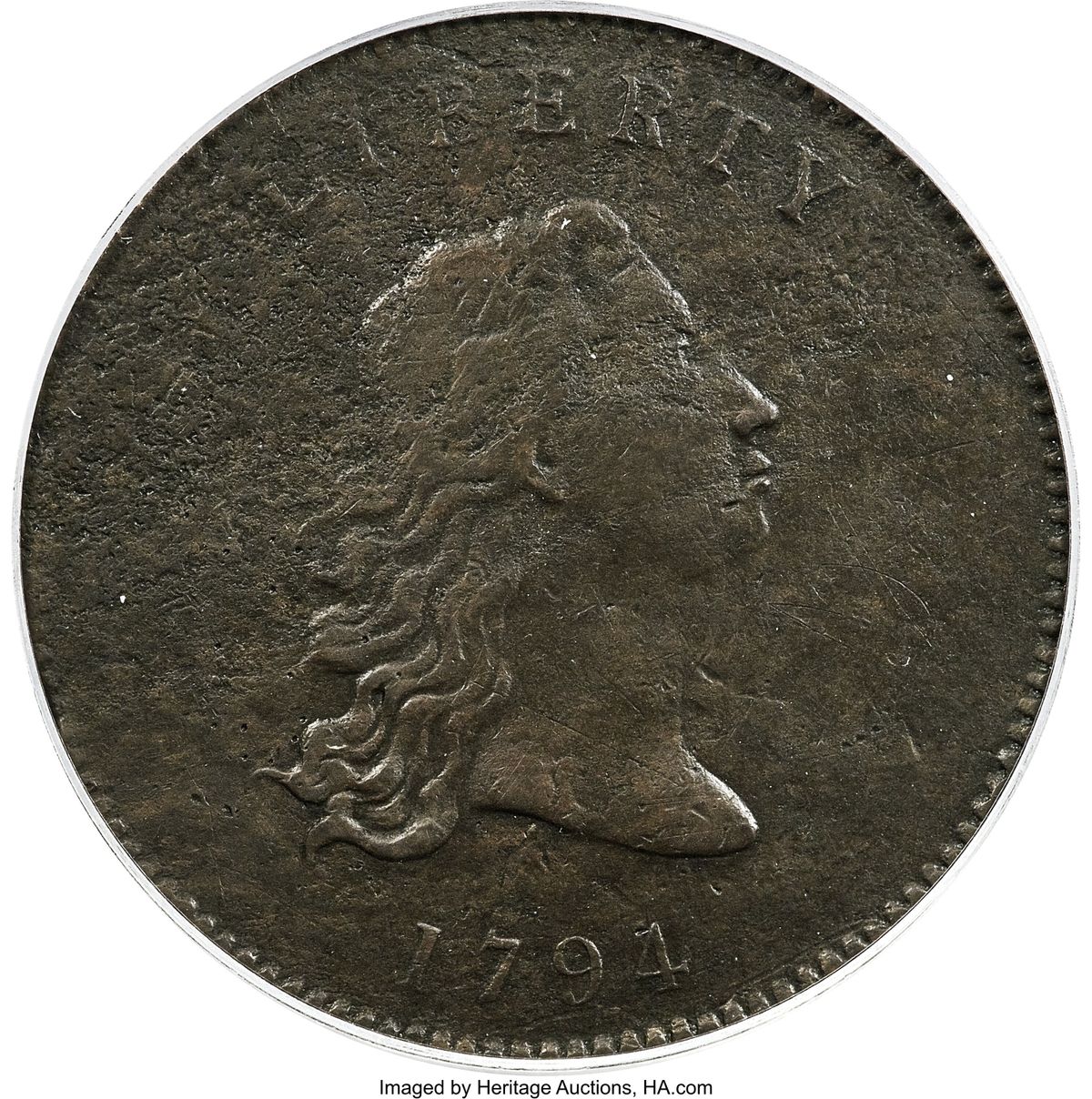 This undated photo provided by Heritage Auctions shows the front of a piece of copper that was struck by the U.S. Mint in Philadelphia in 1794 and was a prototype for the fledgling nation’s money. The item, which is known as the “No Stars Flowing Hair Dollar,” is owned by businessman and Texas Rangers co-chairman Bob Simpson and will go up for auction at Heritage Auctions in Dallas on Friday, April 23, 2021.  (Emily Clements)