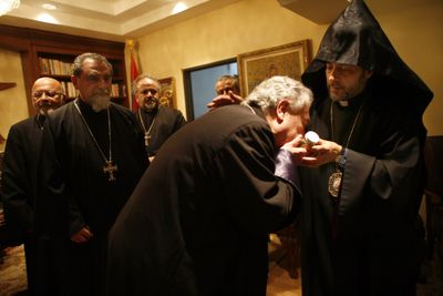 Archbishop Hovnan Derderian, right, of the Western Diocese of the Armenian Church, based in Burbank, Calif., distributes vials of muron Tuesday to priests from across Southern California.Los Angeles Times (Los Angeles Times / The Spokesman-Review)