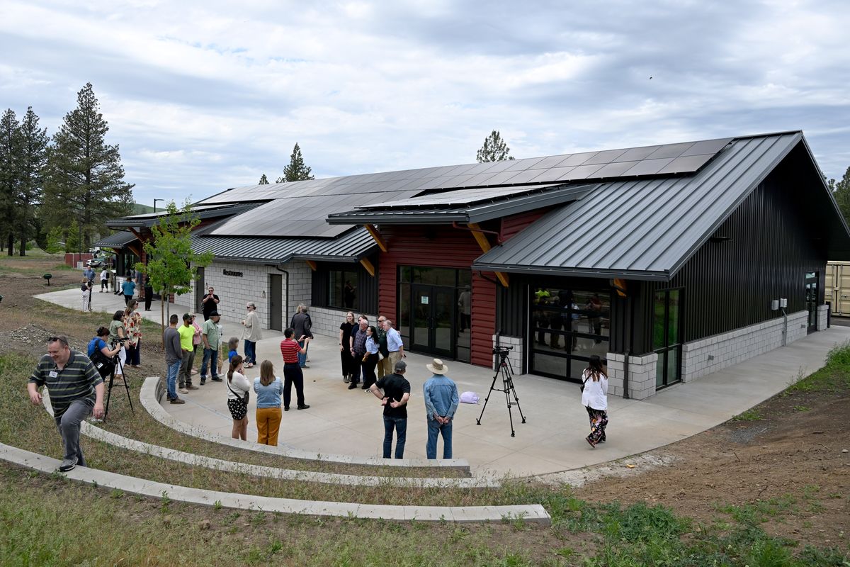 A crowd disperses after city, Whitman County and the state of Washington and representatives of many benefactors and donors had cut the ribbon outside the new community building in Malden, Washington Thursday, May 29, 2025 in the small Whitman County town that burned in wildfires on Labor Day of 2020. The building also houses the library, the food bank and a community meeting room with a kitchen.  (Jesse Tinsley/THE SPOKESMAN-REVIEW)