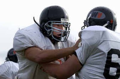 
West Valley High's A.J. Loehding runs a drill during an afterschool practice. Loeding switched from linebacker/fullback to offensive and defensive lines this year to help out the team.
 (Liz Kishimoto / The Spokesman-Review)
