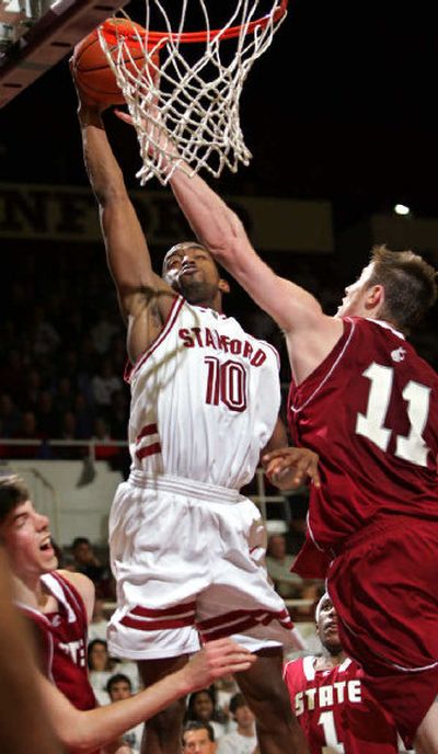 
Stanford guard Tim Morris drives to the basket in front of Washington State center Aron Baynes during the second half.
 (Associated Press / The Spokesman-Review)