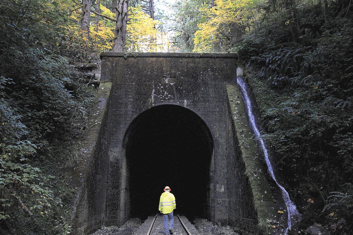 Tom Bishop, manager of Coos Bay Rail Link, walks through Tunnel 13 near Noti, Ore., on Oct. 16. (Associated Press)