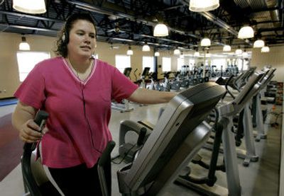 
Rebecca Schill works out at the Daybreak recreation center while waiting for her daughter to finish classes at the attached Daybreak Elementary school. 
 (Associated Press / The Spokesman-Review)