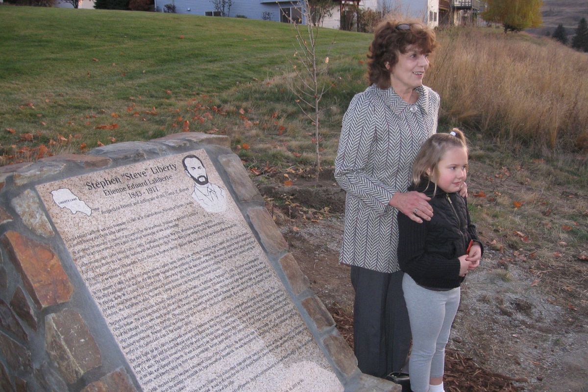 Jackie Moore, the great-granddaughter of Stephen Liberty, and her granddaugher, Ashley Moore, 7, stand next to the memorial dedicated to their ancestor. (Lisa Leinberger)