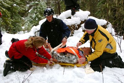Staci Haisley of Spokane, left, works with Britian Whitley of Sandpoint, center, in a winter survival and rescue training exercise during a three-day seminar organized by Priest Lake Search and Rescue. Photo courtesy of Priest Lake SAR (Photo courtesy of Priest Lake SAR / The Spokesman-Review)
