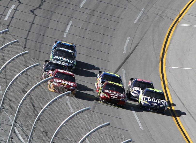 Jimmie Johnson with help from Dale Earnhardt Jr. makes his pass for the lead on the final lap of the Aaron's 499 at Talladega Superspeedway. (Photo Credit: Jerry Markland/Getty Images for NASCAR) (Jerry Markland / Getty Images North America)