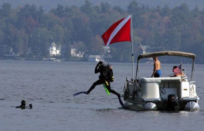 
A diver with the Scuba Unit of the Warren County Sheriff's Department jumps into Lake George on Tuesday where the tour boat The Ethan Allen sank Sunday.  
 (Associated Press / The Spokesman-Review)