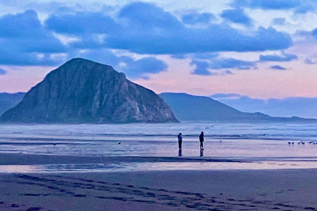 A sunset walk at Morro Strand includes views of Morro Rock. (John Nelson)