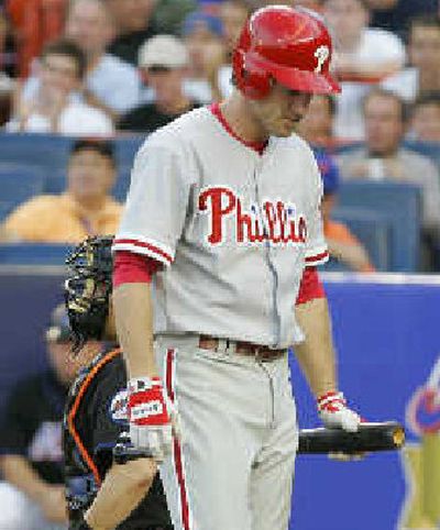 
Philadelphia's Chase Utley heads back to the dugout after striking out in the first inning against the Mets on Friday. 
 (Associated Press / The Spokesman-Review)