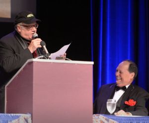 In this Aug. 31, 2015, SR file, Spokesman-Review columnist Doug Clark, left, sings a song parody to Randy Shaw, retiring KREM news anchor, to the tune of Barry Manilow's "Mandy" during the retirement roast for Shaw at the Bing Crosby Theater. (Jesse Tinsley/SR file photo)
