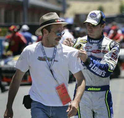 
Jimmie Johnson signs an autograph before returning to the track. Associated Press
 (Associated Press / The Spokesman-Review)