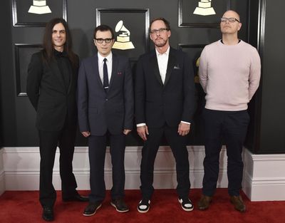 Brian Bell, from left, Rivers Cuomo, Scott Shriner, and Patrick Wilson of the group Weezer arrive at the 59th annual Grammy Awards on Feb. 12, 2017, in Los Angeles. Weezer has released a cover of Totos Africa after a teenage fan pressed the group for months on social media to record the song. (Jordan Strauss / Jordan Strauss/Invision/AP)