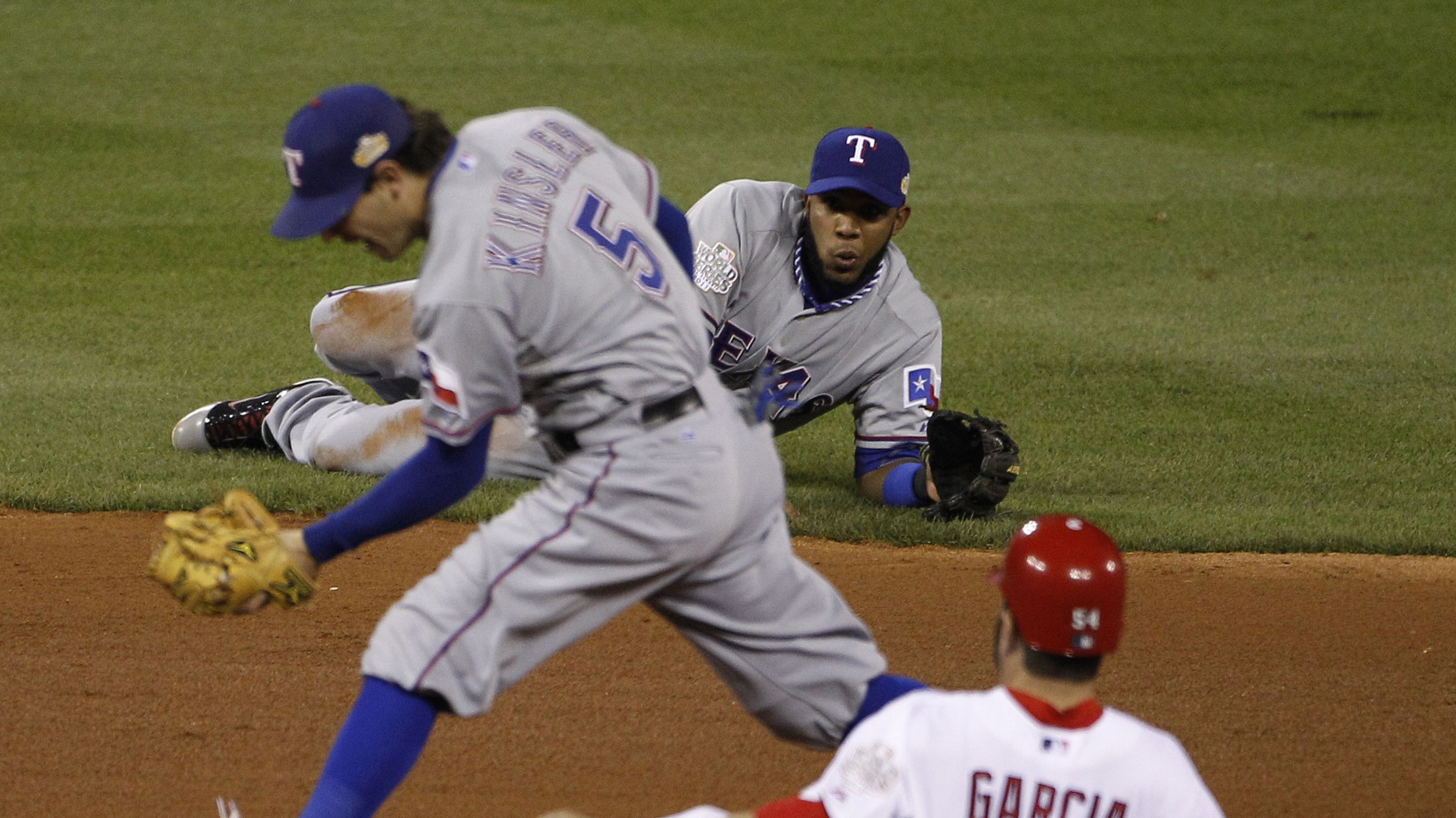 Texas Rangers shortstop Elvis Andrus, left, gets a word from Texas