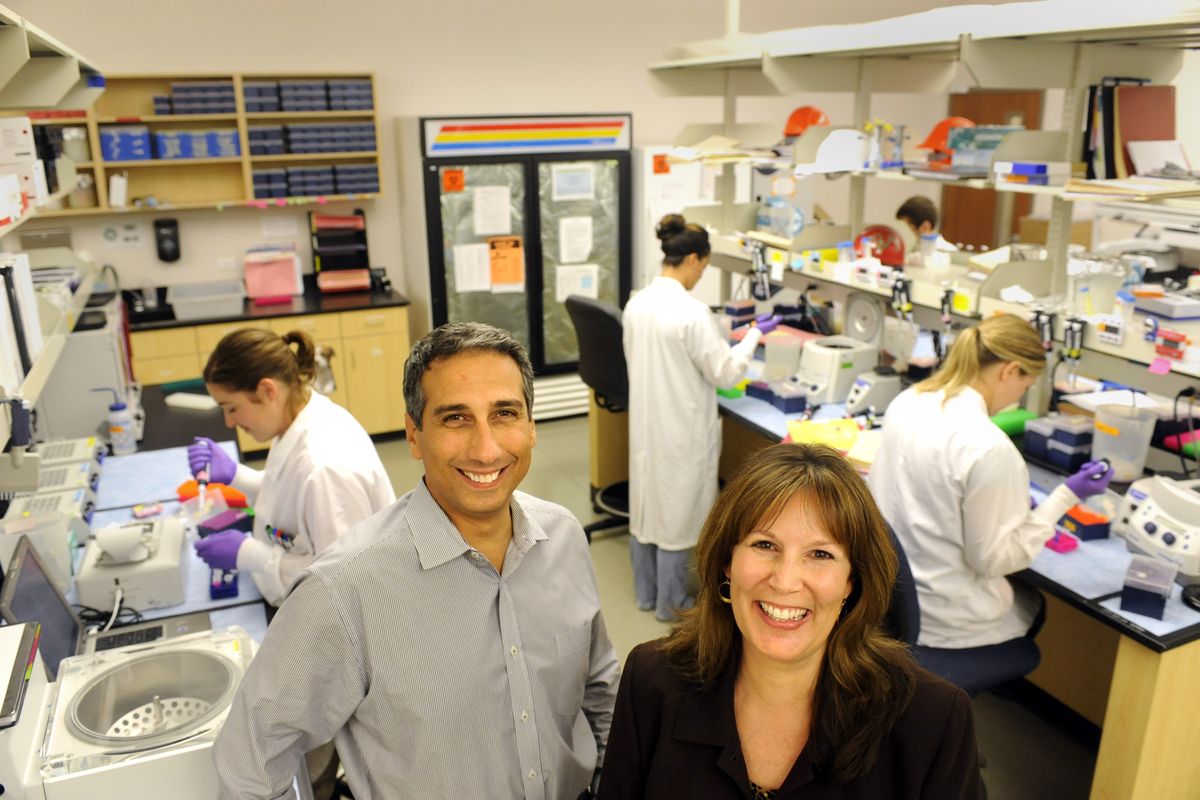 Dr. Bassem Bejjani, left, and Lisa Shaffer, standing in the laboratory in August 2009, are the founders of Signature Genomics, a lab that specializes in testing  for  genetic abnomalities.   The spokesman-Review (File The spokesman-Review)