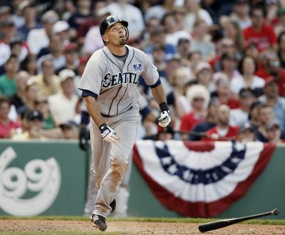 Seattle’s Chris Woodward follows the flight of his game-winning RBI bloop single in the ninth inning.  (Associated Press / The Spokesman-Review)