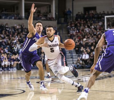 Gonzaga guard Nigel Williams-Goss blasts past Portland guard Andre Ferguson on Jan. 21, 2017, in the McCarthey Athletic Center. The NCAA will be revealing a look at possible tournament seedings in February for the first time in its history. (Dan Pelle / The Spokesman-Review)