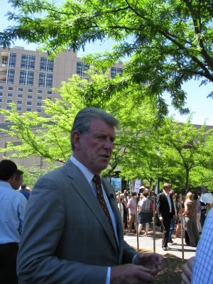 Idaho Gov. Butch Otter talks with reporters in downtown Boise on Tuesday (Betsy Russell)