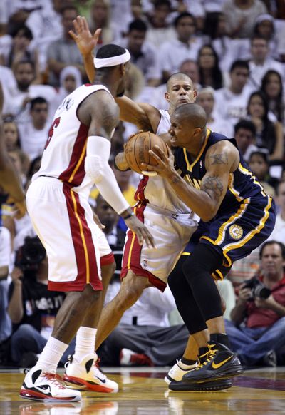 Miami’s LeBron James, left, and Shane Battier pressure Indiana’s David West, who led Pacers with 16 points and 10 rebounds. (Associated Press)