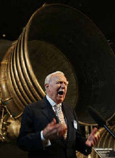 
Walter Cronkite describes his reactions as he reported the landing of the Apollo 11 lunar module on the moon in front of the Saturn 5 Aft End, the F-1 rocket engines of the first stage of the Apollo 11/Saturn 5 launch vehicle, Tuesday. 
 (Associated Press / The Spokesman-Review)