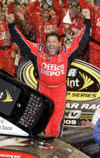 Tony Stewart celebrates in Victory Lane after winning for the first time as a car owner.  (Associated Press / The Spokesman-Review)
