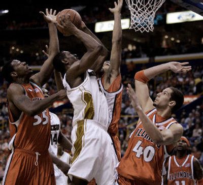 Missouri's Marshall Brown, center, attempts a shot against Illinois' Shaun Pruitt (55) Brian Randle, James Augustine (40) and Dee Brown (11).
(Associated Press / The Spokesman-Review)