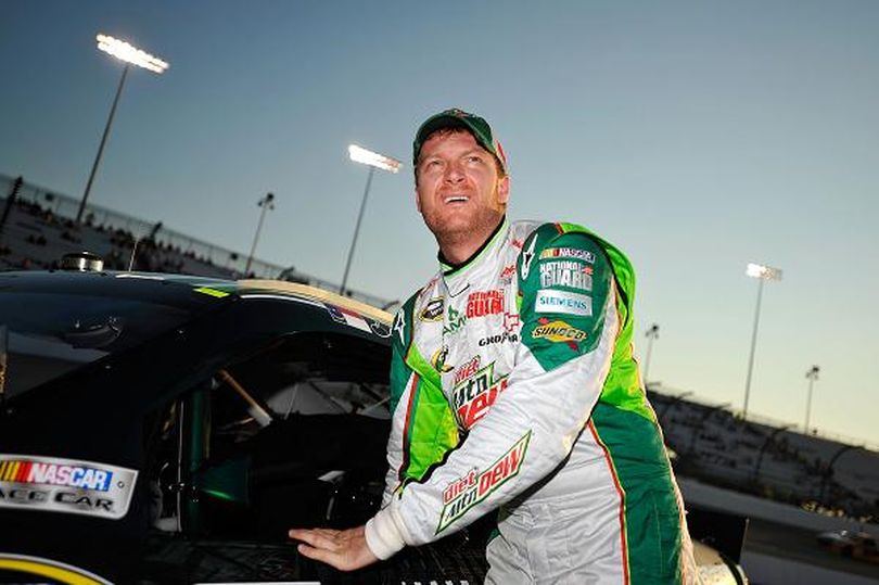 Dale Earnhardt Jr., driver of the #88 Diet Mountain Dew/National Guard Chevrolet, stands by his car during qualifying for the NASCAR Sprint Cup Series Federated Auto Parts 400 at Richmond International Raceway on September 7, 2012 in Richmond, Virginia. (Photo by Rainier Ehrhardt/Getty Images)  (Rainier Ehrhardt / Getty Images North America)
