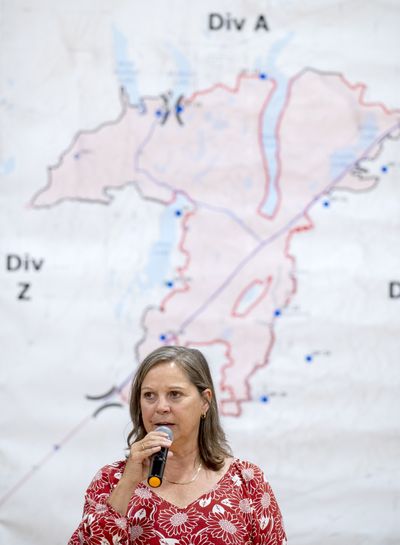 Medical Lake Mayor Terri Cooper speaks Wednesday to a crowd gathered at Medical Lake High School for a community meeting to talk about the catastrophic fires of last weekend in and around the city.  (Jesse Tinsley/THE SPOKESMAN-REVIEW)