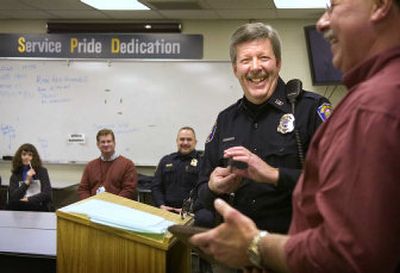 
Spokane Police Chief Roger Bragdon teases police Sgt. Mike Yates at a ceremony honoring three retiring members of the force Friday afternoon. It was Bragdon's last day at work. 
 (Holly Pickett / The Spokesman-Review)
