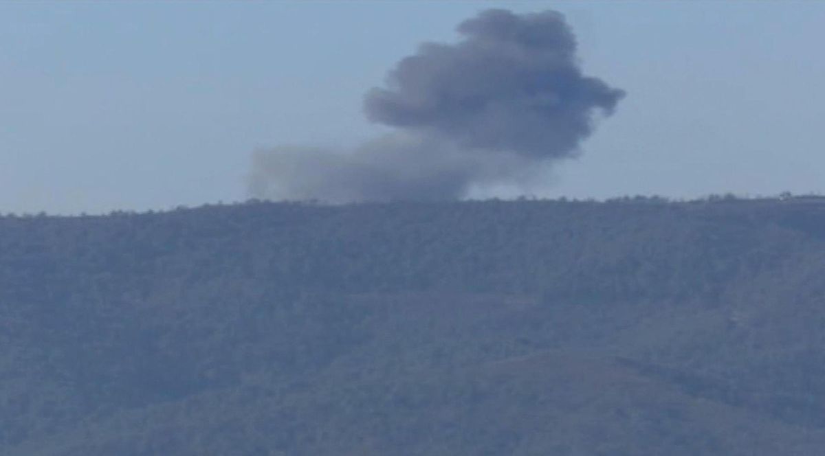 This frame grab from video by Haberturk TV, shows smoke from a Russian warplane after crashing on a hill as seen from Hatay province, Turkey, Tuesday, Nov. 24, 2015. Turkey shot down the Russian warplane Tuesday, claiming it had violated Turkish airspace and ignored repeated warnings. Russia denied that the plane crossed the Syrian border into Turkish skies.