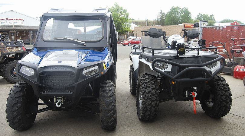 A slimmed-down utility-terrain vehicle, left, is same width as the ATV at right.
